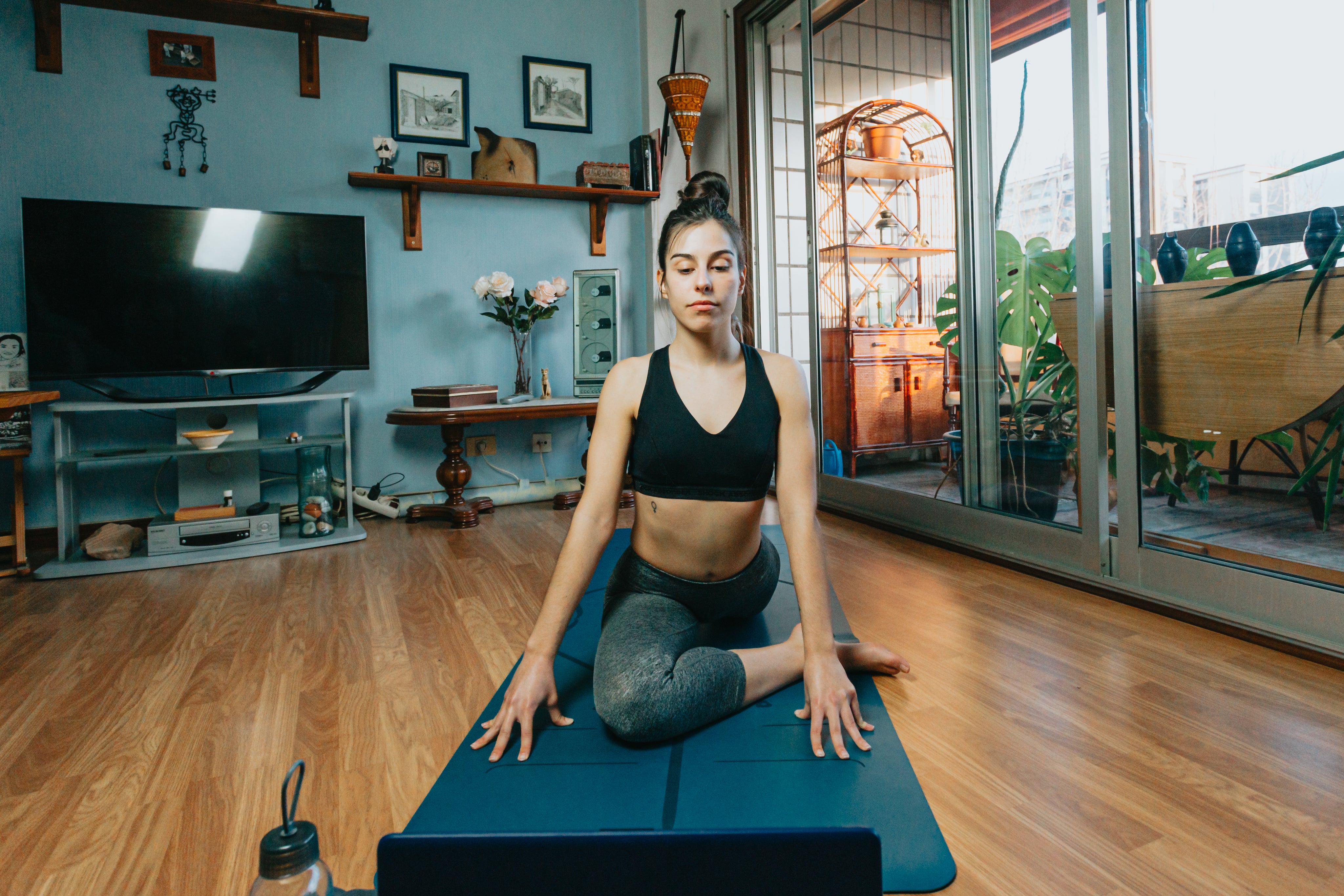files/woman-sits-in-a-yoga-pose-in-their-living-room.jpg